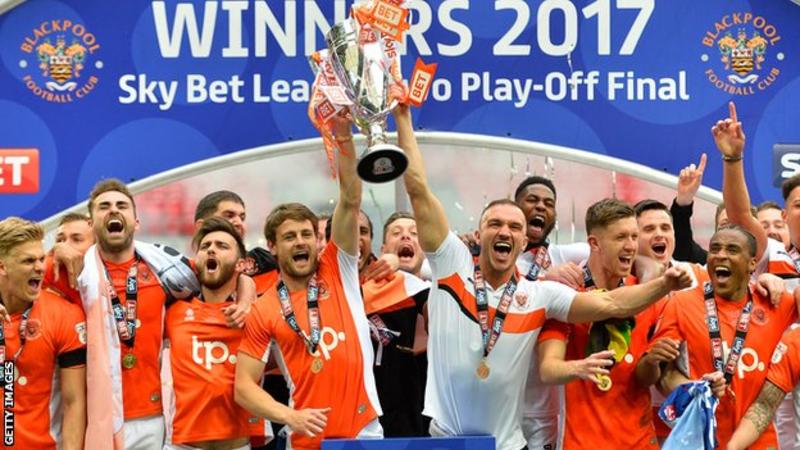 Blackpool FC with playoff trophy