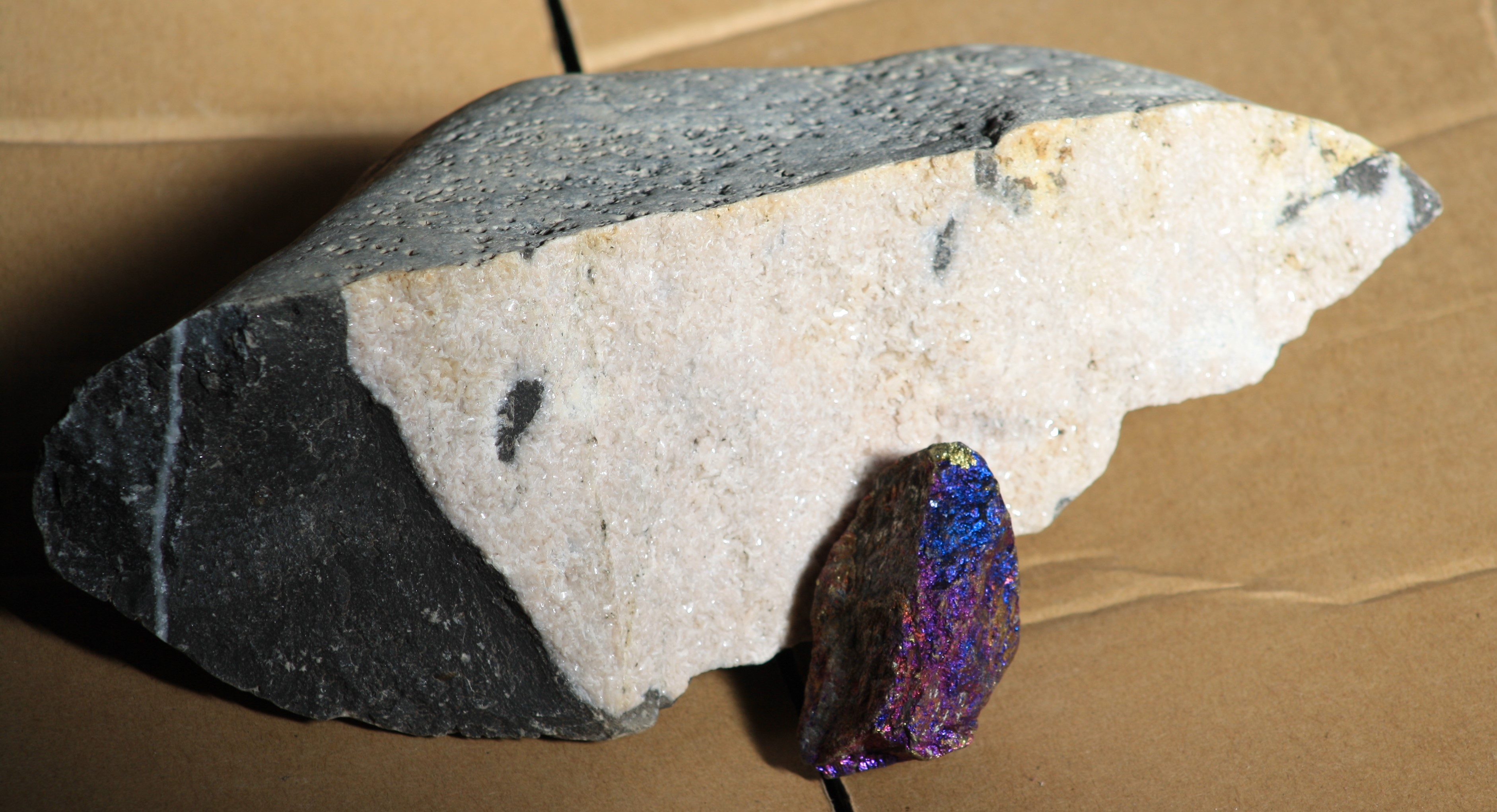 lump of limestone and quartz with smaller purple stone