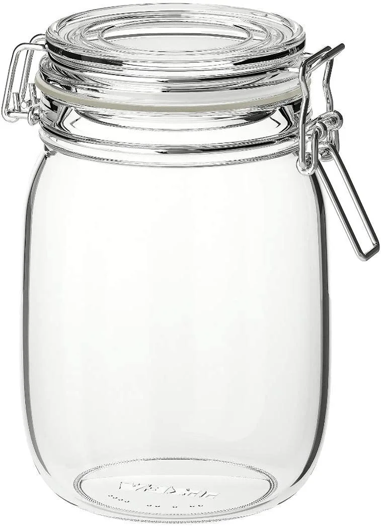 Glass preserving jar with a lid that is fastened with a metal clip