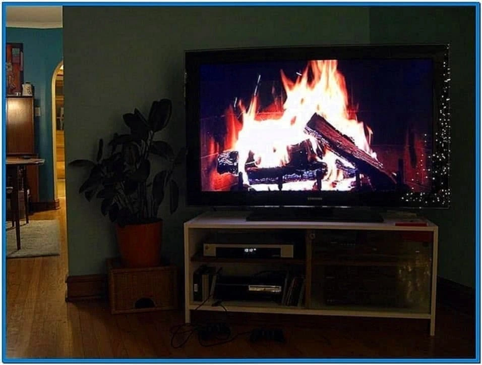 Large flat screen TV showing an image of a real fire