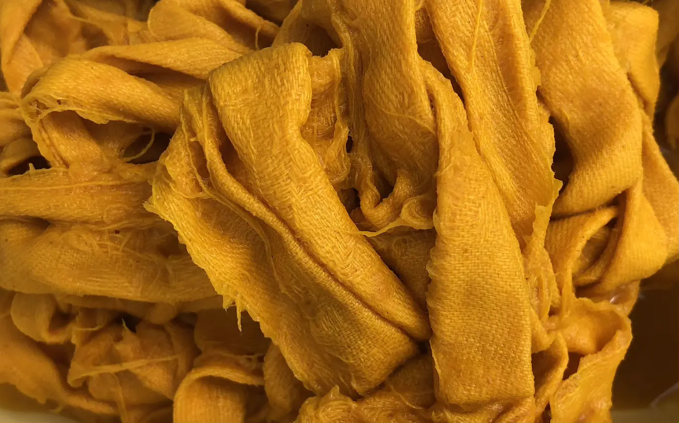 turmeric coloured strips of cloth