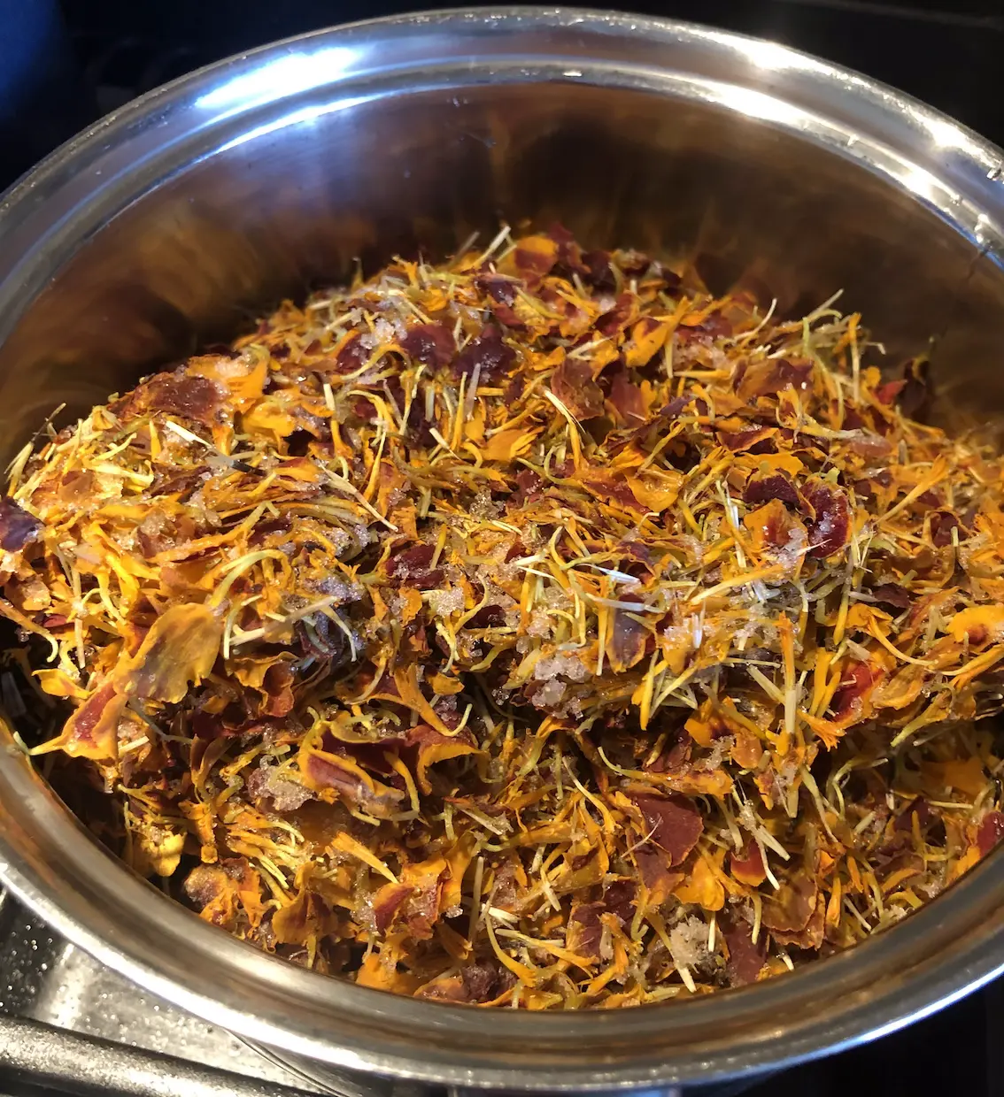 stainless steel pan full of marigold flowers