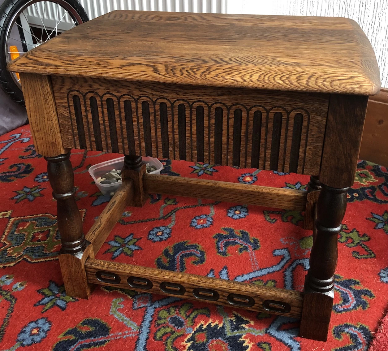 small medium brown table, with carved decoration,