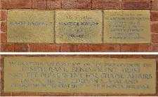 Four sandstone memorial stones set in brickwork of Highfield Methodist Church Hall