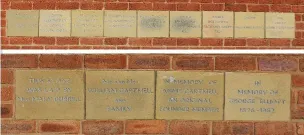 Two sets of sandstone memorial stones set in brickwork of Highfield Methodist Church Hall, Nine in one group and four in the other