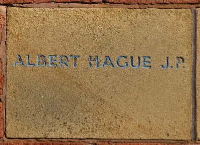 Sandstone memorial stone inscribed 'Albert Hague JP'