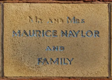 Sandstone memorial stone inscribed 'Mrs and Mrs Maurice Naylor and family'