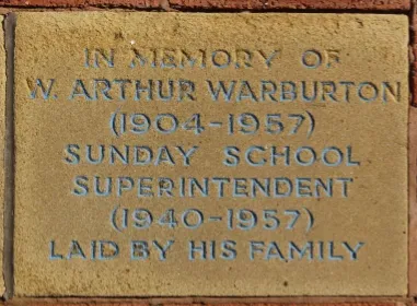 Sandstone memorial stone inscribed 'In memory of W Arthur Warburton, Sunday School Superintendent'