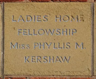 Sandstone memorial stone inscribed 'Ladies Home Fellowship Miss Phyllis M Kershaw'