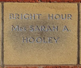 Sandstone memorial stone inscribed 'Bright Hour Mrs Sarah A Hooley'