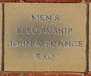 Sandstone memorial stone inscribed 'Men's Fellowship - John A France'