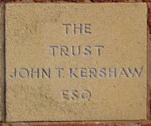 Sandstone memorial stone inscribed 'The Trust John T Kershaw'